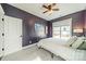 Bedroom with a fan, window, carpet, and a closet at 14533 Holly Springs Dr, Huntersville, NC 28078