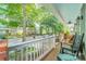 Cozy porch featuring classic wooden rocking chairs and neighborhood views, perfect for relaxing evenings at 14533 Holly Springs Dr, Huntersville, NC 28078