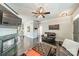 Open-concept living room with a fireplace and hardwood floors, leading to the kitchen at 14533 Holly Springs Dr, Huntersville, NC 28078