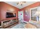 Cozy living room with a rustic wooden entertainment center, comfortable seating, and warm, inviting colors at 14533 Holly Springs Dr, Huntersville, NC 28078