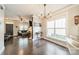 Open floor plan featuring an elegant dining space next to a living room, with hardwood floors at 14533 Holly Springs Dr, Huntersville, NC 28078