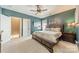 Large main bedroom features a ceiling fan, comfy carpet and closet access at 14533 Holly Springs Dr, Huntersville, NC 28078