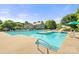 Community pool with a slide and plenty of seating on a sunny day at 14533 Holly Springs Dr, Huntersville, NC 28078