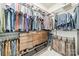Walk-in closet with metal shelving, drawers, and two clothing bars for maximizing storage at 14533 Holly Springs Dr, Huntersville, NC 28078