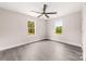 This bedroom features two windows with a nature view and a modern ceiling fan at 1471 Marshbrooke Ln, Catawba, NC 28609