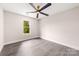 Bright bedroom features a modern ceiling fan, neutral walls, and wood-look flooring at 1471 Marshbrooke Ln, Catawba, NC 28609