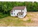 Aerial of a white two-story home featuring a deck and a spacious yard at 1471 Marshbrooke Ln, Catawba, NC 28609