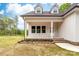 A close up of a covered front porch with brick steps and a house number above the white front door at 1471 Marshbrooke Ln, Catawba, NC 28609
