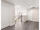Upper level hallway with wood floors provides a view of the chandelier and the living area below at 1471 Marshbrooke Ln, Catawba, NC 28609