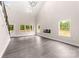 A bright living room with hardwood floors, fireplace, many windows, and high ceilings at 1471 Marshbrooke Ln, Catawba, NC 28609