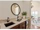 Chic bar area features a sink, wine fridge, and stylish decor at 1500 Lookout Cir, Waxhaw, NC 28173