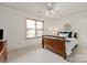 Cozy bedroom with a wood bed frame, complemented by natural light and soft colors for relaxation at 1500 Lookout Cir, Waxhaw, NC 28173