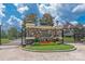 Beautiful stone and iron entrance with flowers and well maintained lawn at 1500 Lookout Cir, Waxhaw, NC 28173