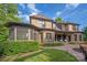 Beautiful brick home with a screened-in porch, patio, and manicured lawn, perfect for outdoor living and relaxation at 1500 Lookout Cir, Waxhaw, NC 28173