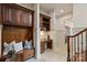 Charming hallway featuring custom built-ins, staircase and designer touches at 1500 Lookout Cir, Waxhaw, NC 28173