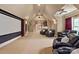 Spacious home theater with projector, screen, and plush seating, perfect for movie nights and entertainment at 1500 Lookout Cir, Waxhaw, NC 28173