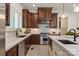 This modern kitchen is equipped with stainless steel appliances and stone countertops at 1500 Lookout Cir, Waxhaw, NC 28173