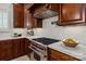 Close up on modern kitchen equipped with stainless steel appliances and stone countertops at 1500 Lookout Cir, Waxhaw, NC 28173