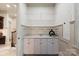 Well-organized laundry room with ample storage, perfect for keeping things tidy at 1500 Lookout Cir, Waxhaw, NC 28173