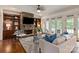 Cozy living room with stone fireplace, built-in shelves, and French doors at 1500 Lookout Cir, Waxhaw, NC 28173