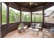 Cozy screened-in porch with comfortable seating, perfect for relaxing outdoors at 1500 Lookout Cir, Waxhaw, NC 28173