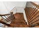 Elegant wooden staircase with black iron railings, providing a classic and stylish transition at 1500 Lookout Cir, Waxhaw, NC 28173