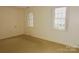 Bedroom with neutral walls, carpet, and windows at 153 Perrin Pl, Charlotte, NC 28207