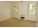 Airy bedroom with bright windows with shutters and a carpeted floor at 153 Perrin Pl, Charlotte, NC 28207