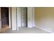 Bedroom features a reach-in closet with folding doors, providing additional storage space at 153 Perrin Pl, Charlotte, NC 28207