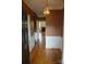 Inviting foyer featuring classic wainscoting, hardwood floors, and a vintage light fixture at 153 Perrin Pl, Charlotte, NC 28207