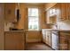 Kitchen with lots of wooden cabinets and white counter tops at 153 Perrin Pl, Charlotte, NC 28207