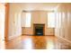 Spacious living room with hardwood floors and a classic fireplace at 153 Perrin Pl, Charlotte, NC 28207