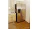 Stainless steel refrigerator with double door in kitchen with wood cabinets at 153 Perrin Pl, Charlotte, NC 28207