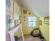 Cozy attic space with a window, quirky decor, and a comfortable beanbag chair at 153 S Center St, Taylorsville, NC 28681