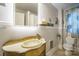 Charming bathroom with unique vanity, illuminated mirror, and decorative accents at 153 S Center St, Taylorsville, NC 28681
