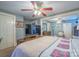 Bedroom with a large wood bed frame, light blue walls, and decorative quilt at 153 S Center St, Taylorsville, NC 28681