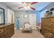 Comfortable bedroom with ample storage, neutral carpet, and ceiling fan at 153 S Center St, Taylorsville, NC 28681