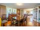 Inviting dining room featuring wood floors, adjacent to the living room, with access to the outdoors via glass doors at 153 S Center St, Taylorsville, NC 28681