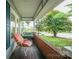 Relaxing porch area with a porch swing and view of the front yard at 153 S Center St, Taylorsville, NC 28681