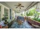 Inviting front porch featuring cozy furniture and a decorative outdoor rug at 153 S Center St, Taylorsville, NC 28681