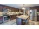 Modern kitchen featuring stainless steel appliances, a tile backsplash, and a convenient island at 153 S Center St, Taylorsville, NC 28681