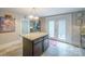 Bright kitchen with a central island, double doors to outside, and classic cabinetry at 153 S Center St, Taylorsville, NC 28681