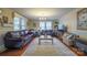 Spacious living room filled with natural light and plush leather furnishings at 153 S Center St, Taylorsville, NC 28681