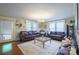 Cozy living room featuring hardwood floors and comfortable seating arrangements at 153 S Center St, Taylorsville, NC 28681