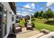 Backyard patio with seating, pergola, and playground equipment at 1569 Shannon Falls Dr, Fort Mill, SC 29715