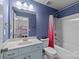 Blue bathroom featuring a vanity, toilet, and a shower-tub combination at 1569 Shannon Falls Dr, Fort Mill, SC 29715