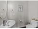 Powder room features stylish vanity, toilet, and decorative wall art at 1569 Shannon Falls Dr, Fort Mill, SC 29715