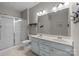 Bathroom features double sinks, a large mirror, and a walk-in shower at 1569 Shannon Falls Dr, Fort Mill, SC 29715