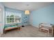 Bright bedroom with blue walls, carpet, and a window view of the outdoors at 1569 Shannon Falls Dr, Fort Mill, SC 29715