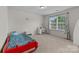 Bedroom featuring a red bed frame, a large window, and a desk at 1569 Shannon Falls Dr, Fort Mill, SC 29715